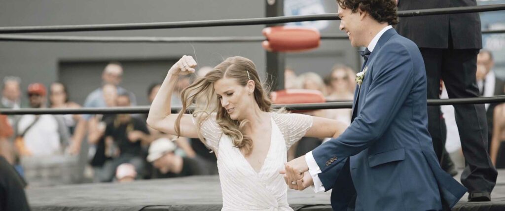 bride and groom posing at wresting tournament