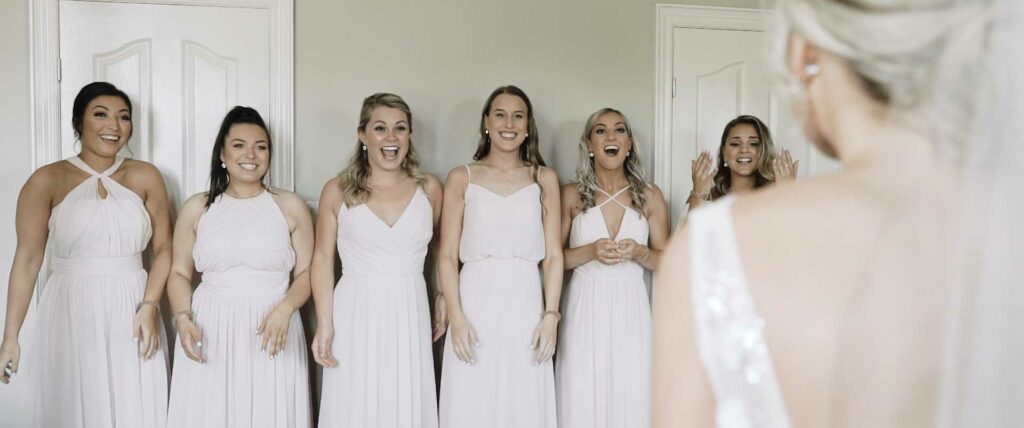 first look with bridesmaids at wedding